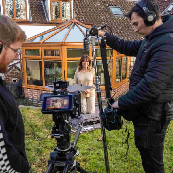 Sound Engineer and DOP filming Carol Smillie outside conservatory