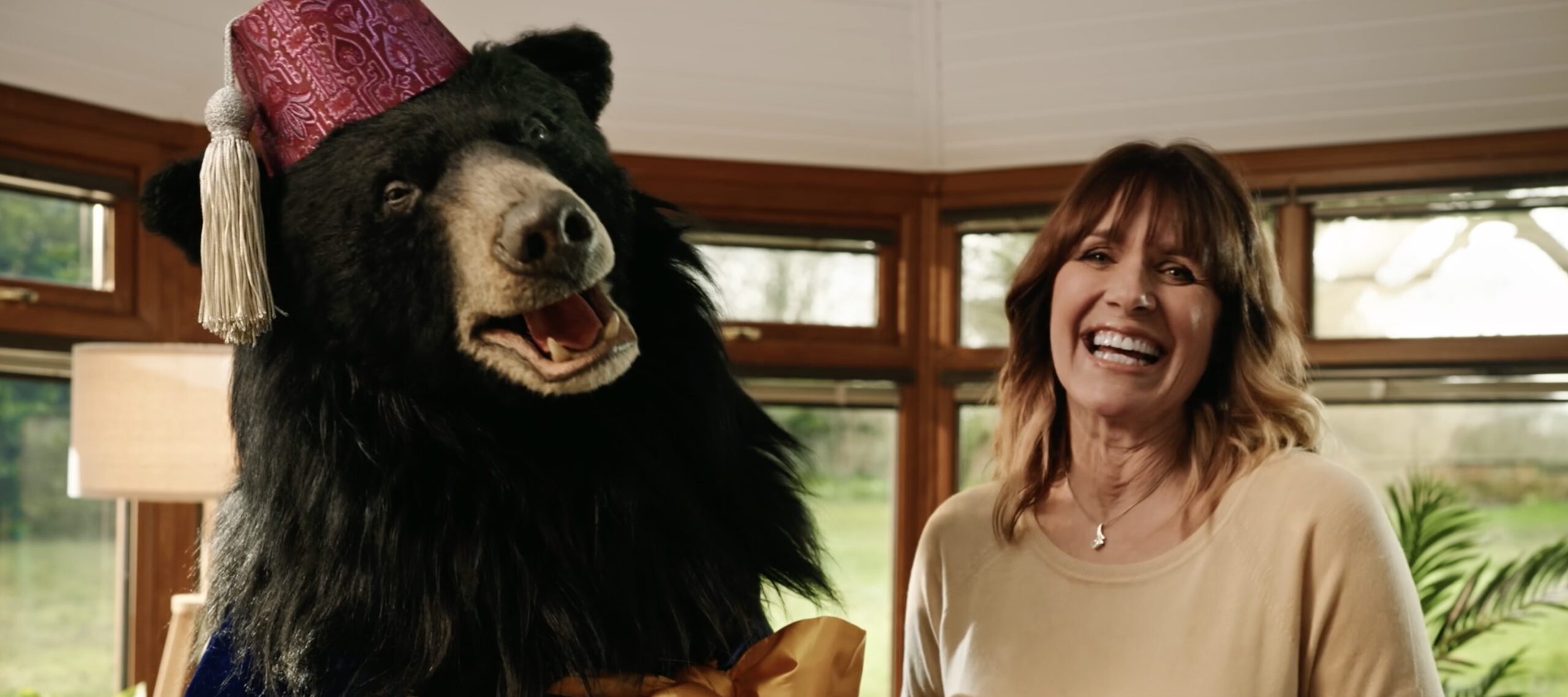 Carol Smillie next to magician bear for Conservandsave TV advert