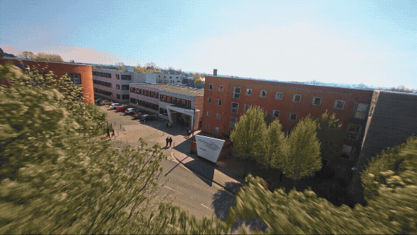 FPV drone flythrough tour. Outside of Stratford-upon-Avon college transition to inside music theatre with a band concert performance