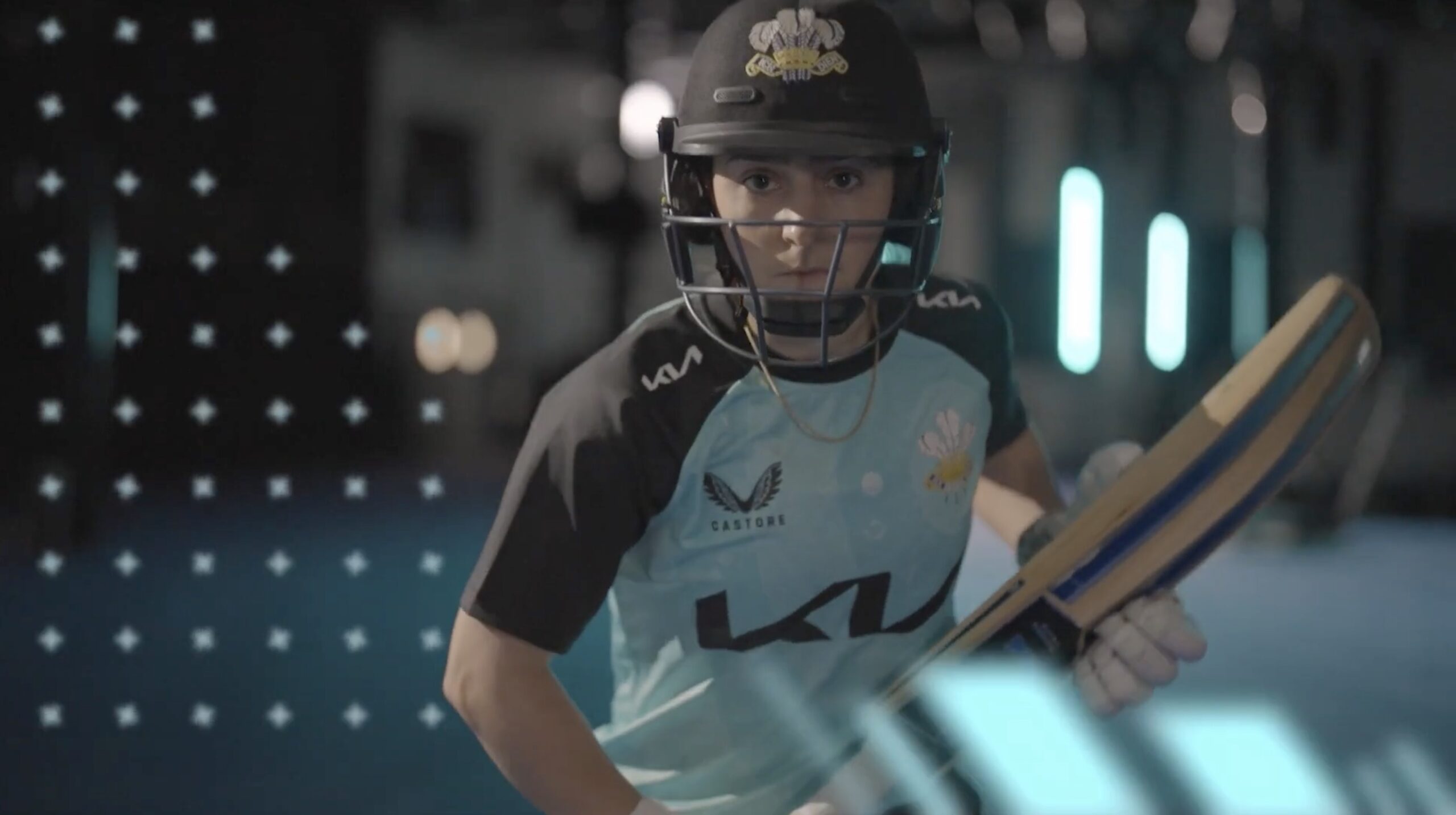 Kia Oval Surrey County cricketer in kit wearing helmet and holding cricket bat
