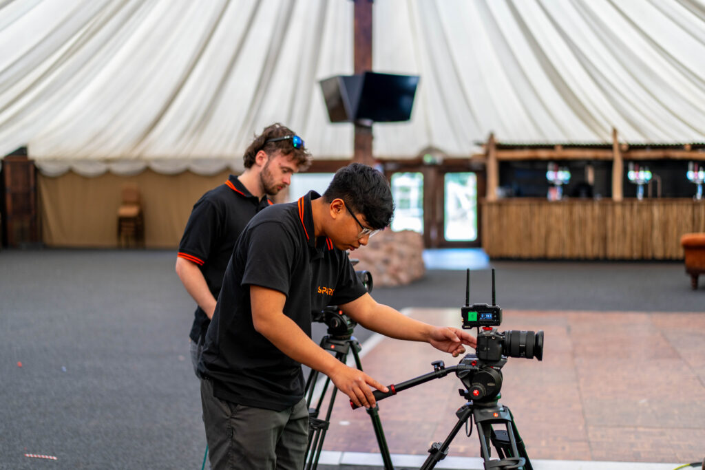 Camera operators Denson and Harry setting up the filming equipment.