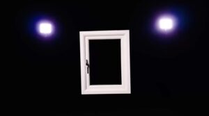 White polyframe window frame in black studio setting with cinematic lights.