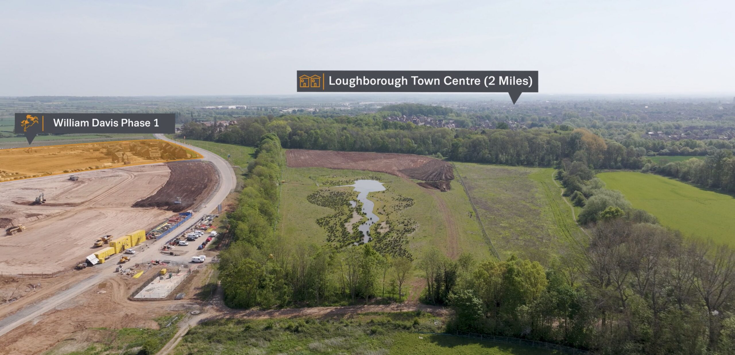 A drone shot of William Davis Homes' new development Garendon Park with tracked graphics that read Loughborough Town Centre (2 mins) and William Davis Phase 1.