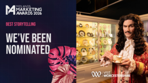 On the left: Dark purple background, pink leaf to the right. Midlands Marketing Awards 2026 Logo. Pink text reads Best Storytelling. White large text says We've Been Nominated. To the right: a photo of a King Charles II lookalike holding a china teacup at the Royal Worcester Museum with the Visit Worcestershire logo at the bottom.