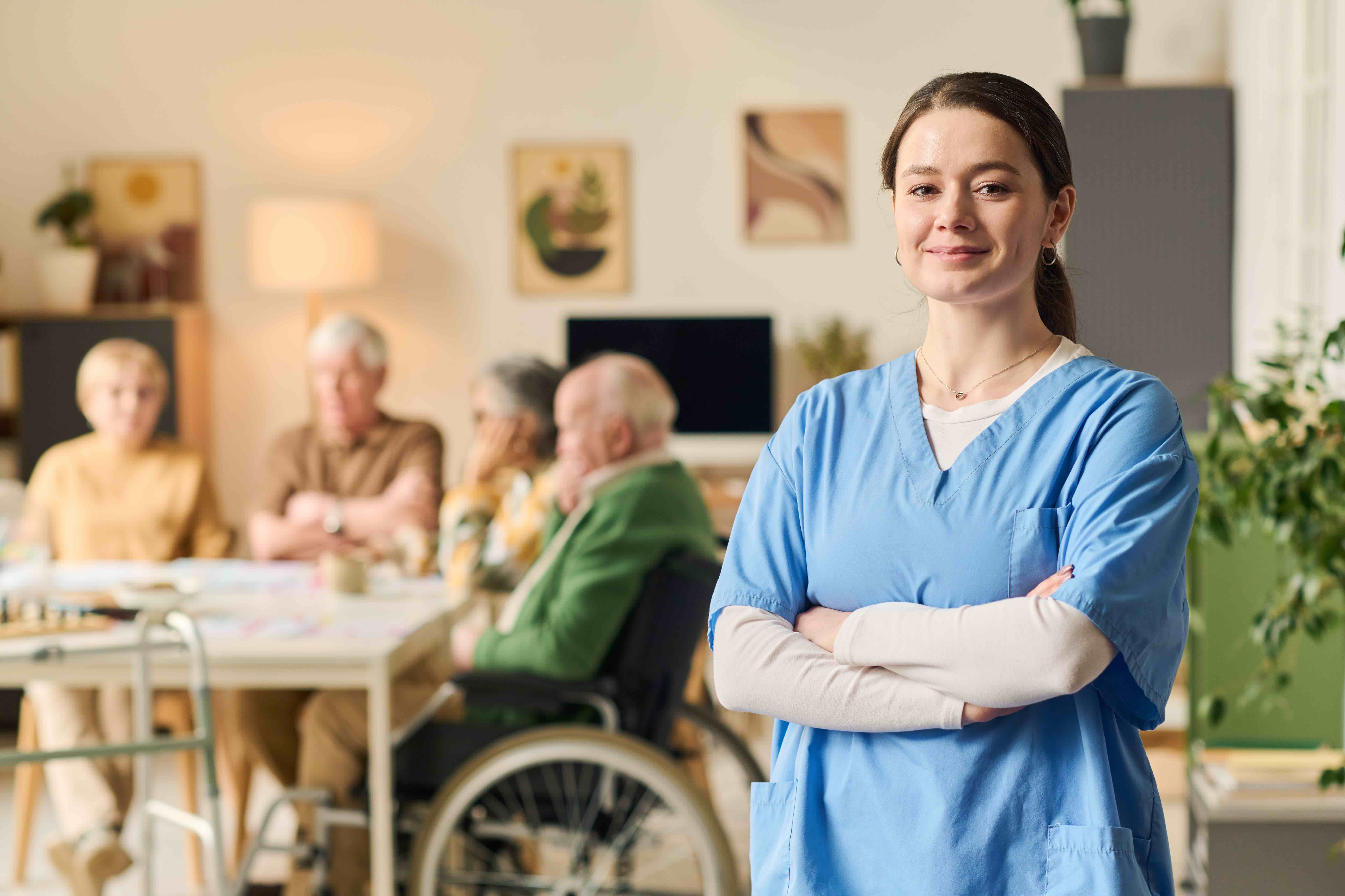 Portrait of Adult Caregiver Standing in Senior Care Facility